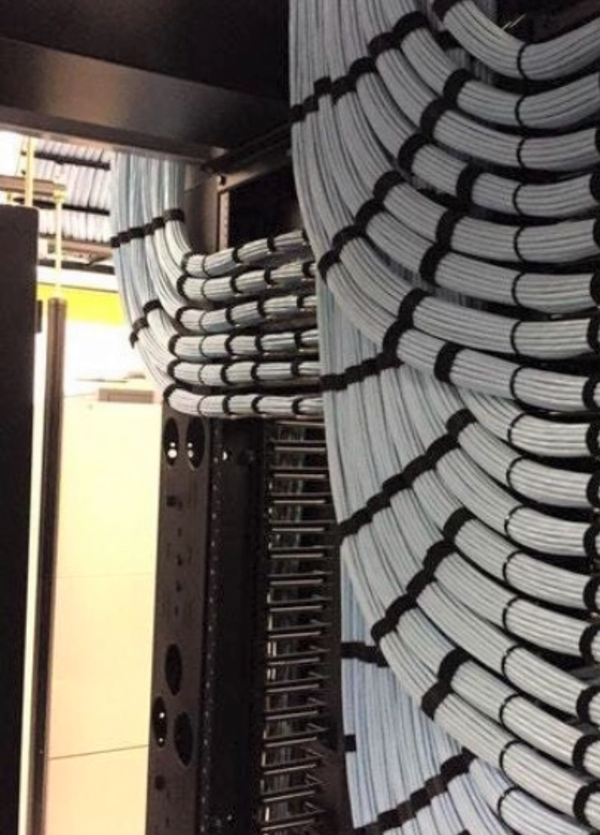 Certified low voltage technician installing structured cabling for commercial network infrastructure